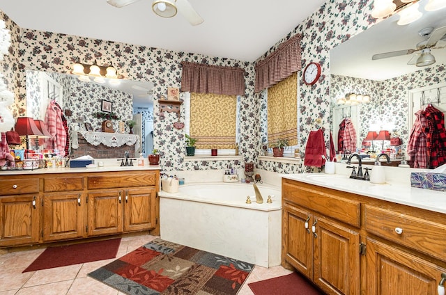 bathroom featuring tile patterned floors, vanity, ceiling fan, and a bath