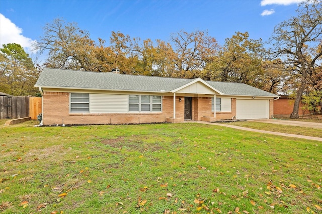 ranch-style home featuring a garage and a front lawn