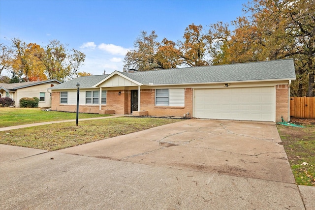 single story home with a front yard and a garage