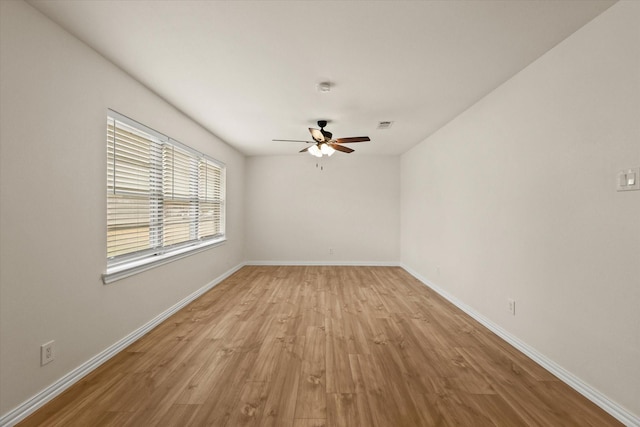 unfurnished room with ceiling fan and light hardwood / wood-style flooring