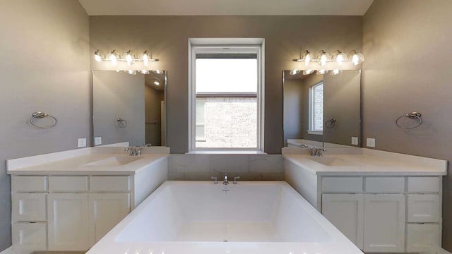 bathroom featuring a tub and vanity