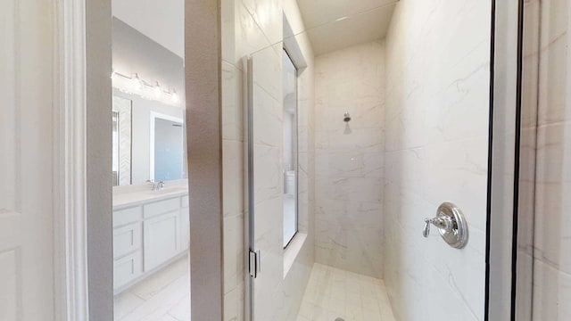 bathroom featuring vanity and a shower with shower door