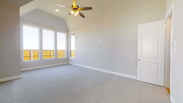 spare room featuring light colored carpet and ceiling fan