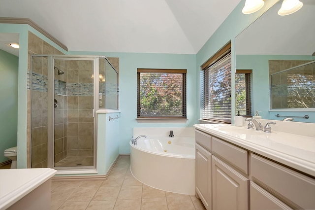 full bathroom featuring lofted ceiling, tile patterned floors, toilet, vanity, and independent shower and bath