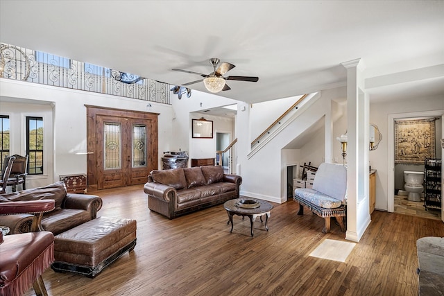 living room with ceiling fan and hardwood / wood-style flooring