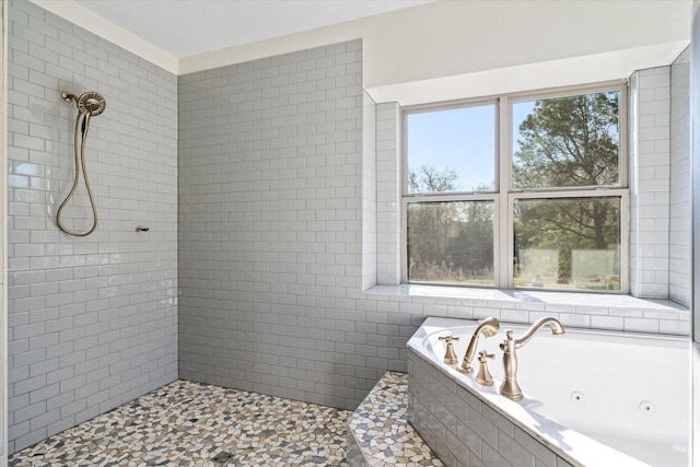 bathroom with plenty of natural light and separate shower and tub