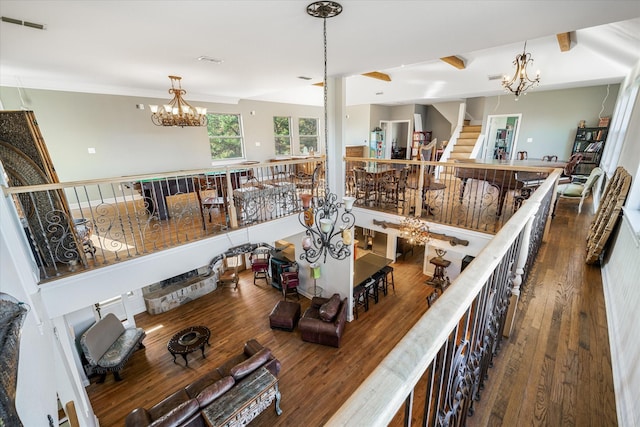 interior space featuring a chandelier and wood-type flooring