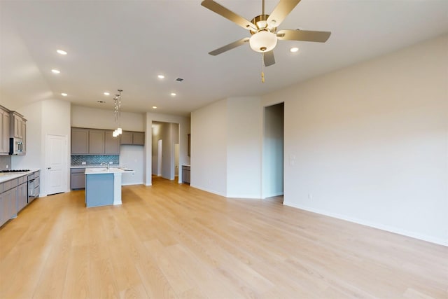 7220 Monarch Trl, Mckinney, TX 75071 - unfurnished living room with ceiling fan, light wood-style flooring, recessed lighting, lofted ceiling, and baseboards