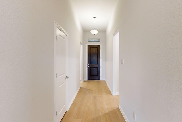 7220 Monarch Trl, Mckinney, TX 75071 - hallway with light wood-style floors and baseboards