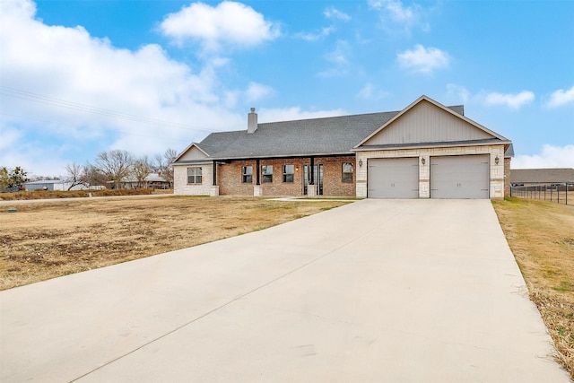 view of front of house with a garage and a front yard