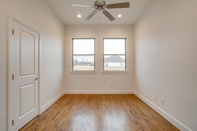 unfurnished room featuring ceiling fan and wood-type flooring