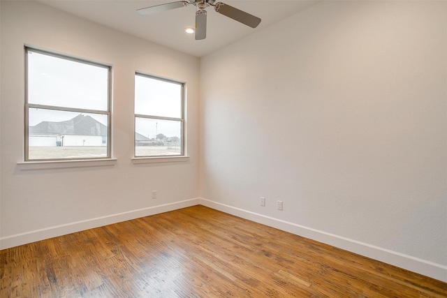 spare room featuring ceiling fan and light hardwood / wood-style flooring