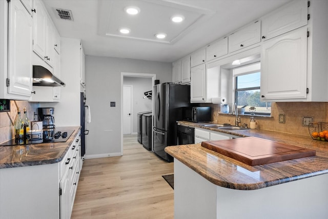 kitchen featuring kitchen peninsula, sink, black appliances, light hardwood / wood-style flooring, and white cabinets