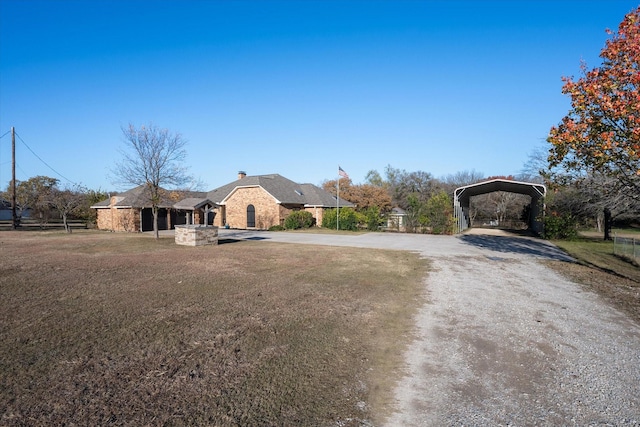 view of front of home featuring a carport