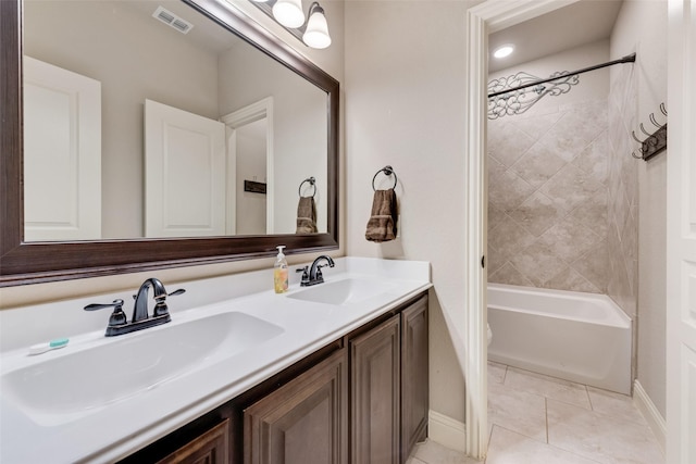 full bathroom with tile patterned floors, vanity, toilet, and tiled shower / bath combo