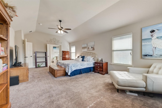 bedroom with ceiling fan, light carpet, and vaulted ceiling