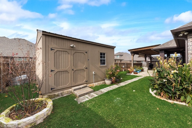 view of outbuilding with a yard