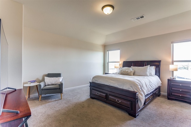 bedroom with light colored carpet