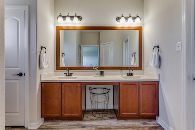 bathroom featuring hardwood / wood-style floors and vanity