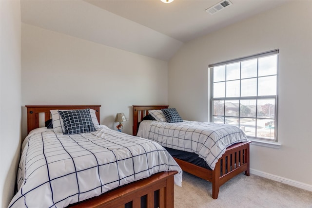 bedroom featuring light carpet and vaulted ceiling