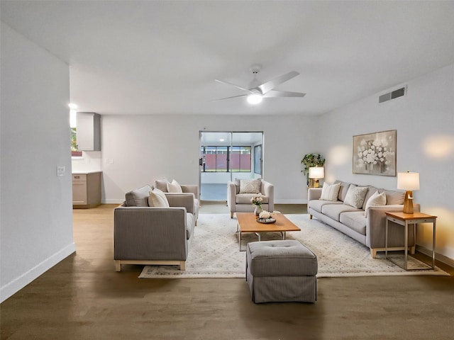 living room featuring hardwood / wood-style floors, plenty of natural light, and ceiling fan