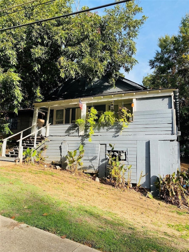 view of home's exterior with a yard