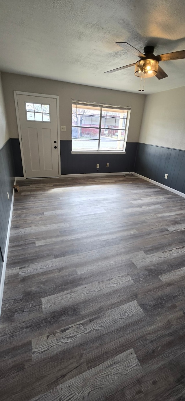 foyer featuring ceiling fan and dark hardwood / wood-style floors