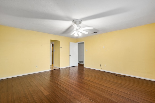 empty room with hardwood / wood-style flooring and ceiling fan