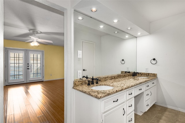 bathroom featuring french doors, ceiling fan, vanity, and hardwood / wood-style floors