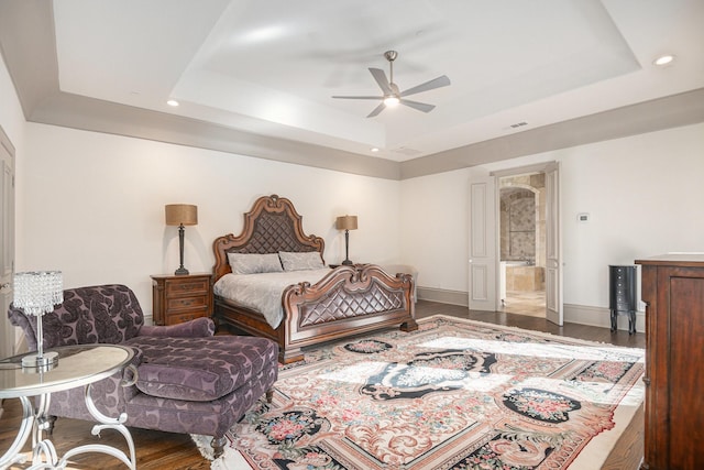 1714 Maranatha Way, Southlake, TX 76092 - bedroom with a tray ceiling, wood finished floors, recessed lighting, ensuite bathroom, and a ceiling fan