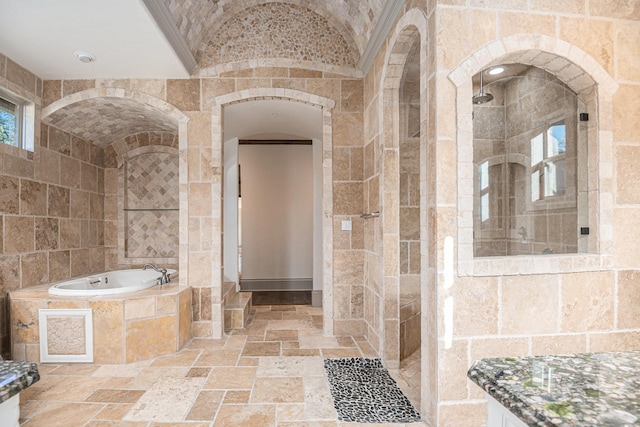 bathroom with lofted ceiling and independent shower and bath