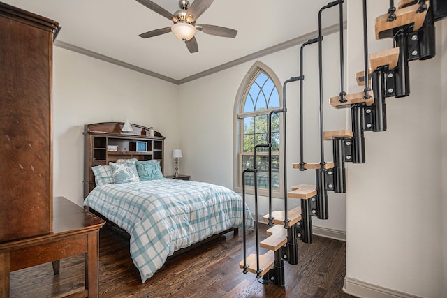 bedroom with dark wood-type flooring, ceiling fan, and crown molding