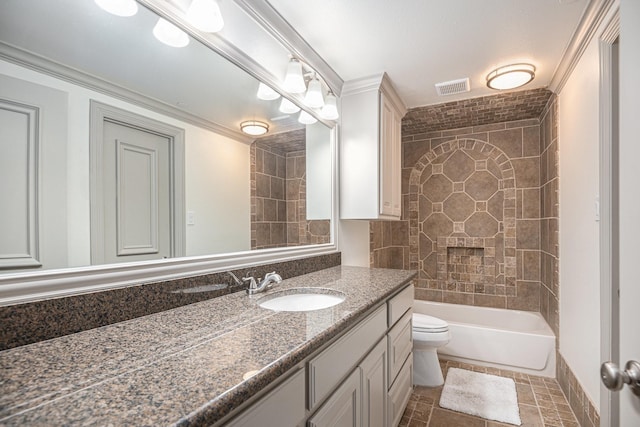 full bathroom featuring tiled shower / bath, a large fireplace, vanity, toilet, and crown molding