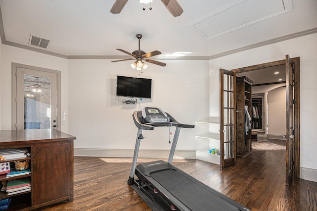 exercise room featuring crown molding, ceiling fan, and dark hardwood / wood-style floors