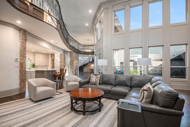 1714 Maranatha Way, Southlake, TX 76092 - living area with a towering ceiling, stairs, wood finished floors, recessed lighting, and decorative columns