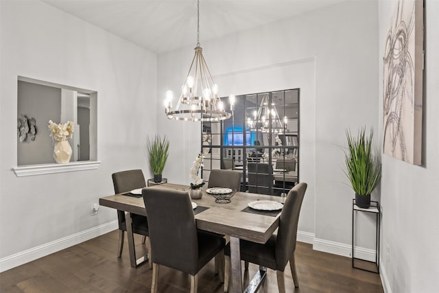 dining room with a chandelier and dark hardwood / wood-style floors