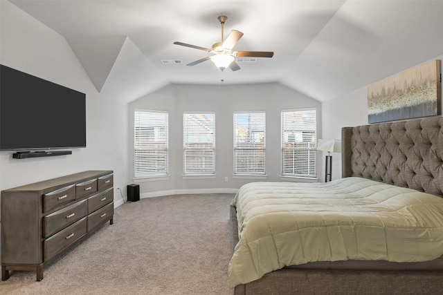 bedroom featuring light carpet, multiple windows, ceiling fan, and lofted ceiling