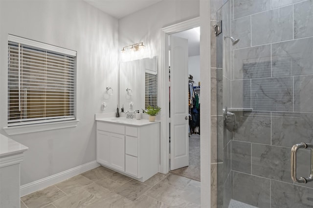 bathroom featuring vanity and a shower with shower door