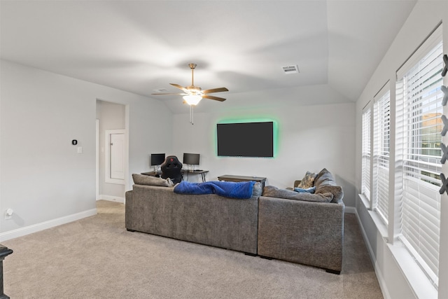 living room with carpet flooring, ceiling fan, and lofted ceiling