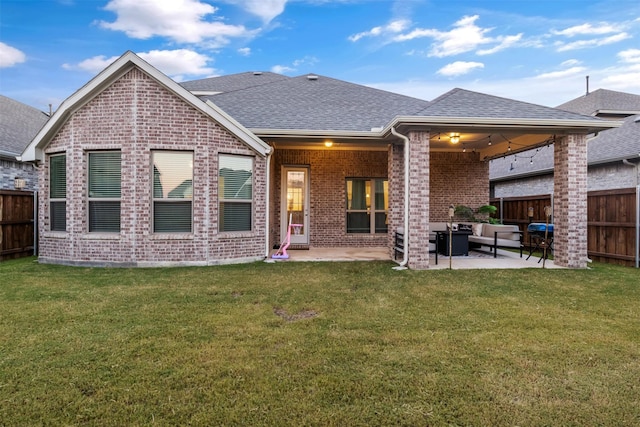 back of property featuring outdoor lounge area, a yard, ceiling fan, and a patio area