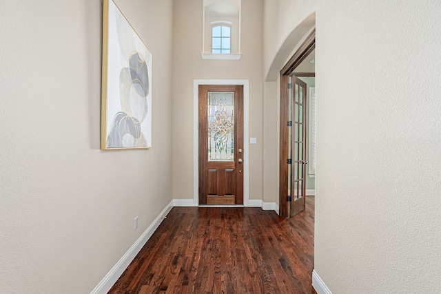 doorway featuring dark wood-type flooring