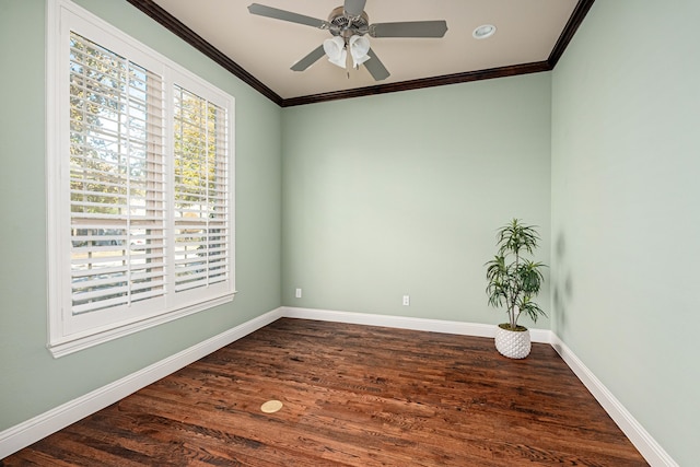 unfurnished room with ceiling fan, ornamental molding, and dark wood-type flooring