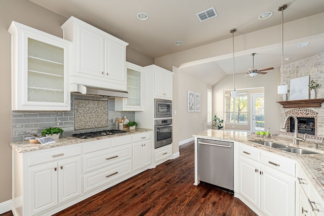 kitchen featuring sink, white cabinets, stainless steel appliances, and dark hardwood / wood-style floors