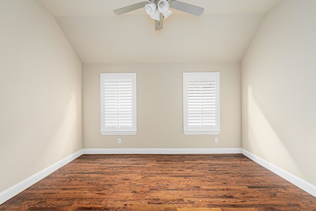 spare room featuring lofted ceiling, ceiling fan, and dark hardwood / wood-style floors