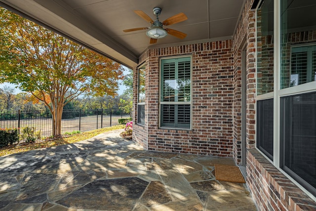 view of patio featuring ceiling fan