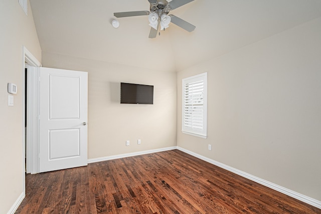 unfurnished room with ceiling fan and dark hardwood / wood-style flooring