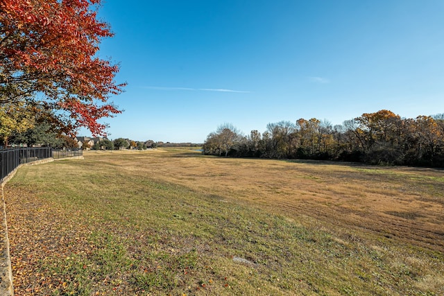 view of yard with a rural view