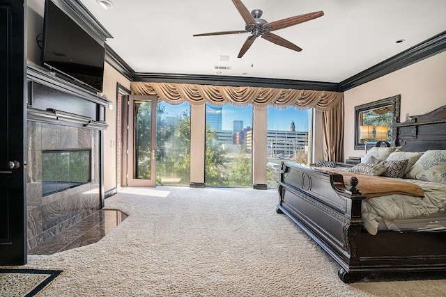 carpeted bedroom with ornamental molding, access to outside, and ceiling fan