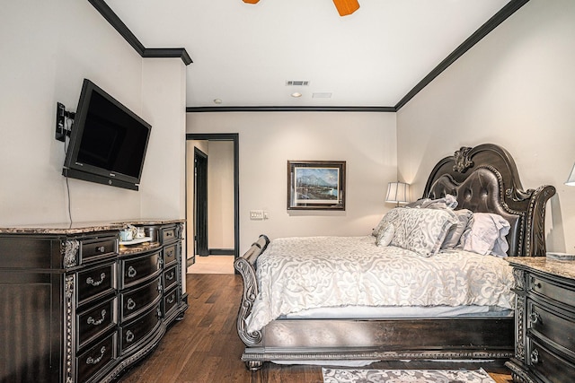 bedroom featuring crown molding, ceiling fan, and dark hardwood / wood-style flooring