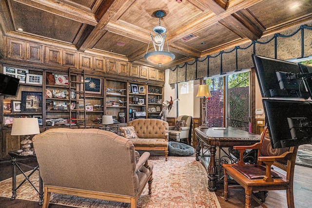 sitting room with hardwood / wood-style floors, coffered ceiling, ornamental molding, wooden ceiling, and beamed ceiling